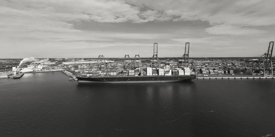A cargo ship moored at an industrial port